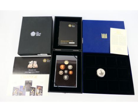 A Royal mint 2008 United Kingdom Proof Coin Collection and a 2006 1oz Silver Britannia coin. [2]. [W]