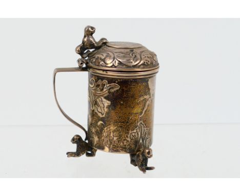 A Victorian silver mustard pot, of cylindrical form, the domed lid embossed and etched with a foliate wreath surrounding a Ge