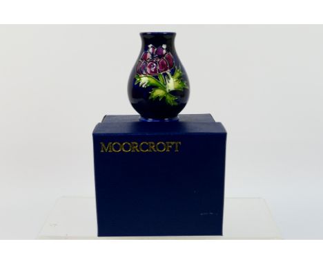 Moorcroft - A small Moorcroft Pottery vase of baluster form, decorated in the Anemone pattern, 1994, factory marks to the bas