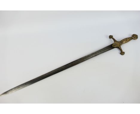A 19th century band sword with 65 cm (l) with twin fullers, the hilt with scroll decoration, approximately 79 cm (l) overall.