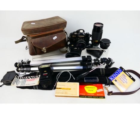 Photography - A Chinon CE-4 camera with attached Vivitar 1:3.5-4.5, 28-50mm lens, additional Sunagor 1:4.5, 80-200mm lens and