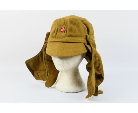 A Soviet Russian army canvas field (OKZK), with cap badge. [W]