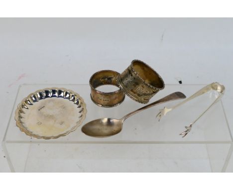 Silver group to include napkin rings, pin dish, sugar tongs and similar, various assay and date marks, approximately 150 gram