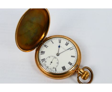 The Angus - A Swiss made 15 jewel, full hunter, gold plated pocket watch, Roman numerals to a white enamel dial with subsidia