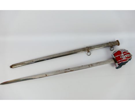 A basket hilt Highland Broadsword type sword with 86 cm (l) blade, the basket guard pierced with hearts and circles, containe