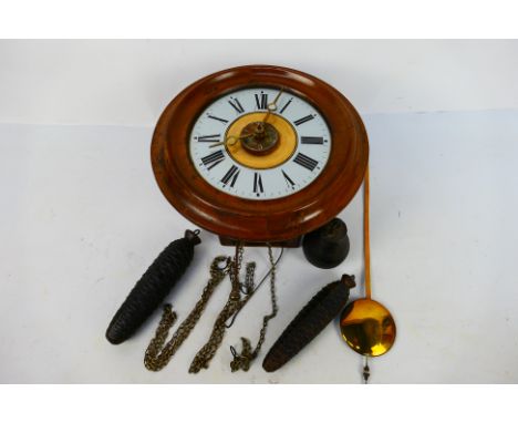 A good example of a 'postman's alarm' wall clock, the 7" white dial having Roman numerals and matched brass hands, alarm sett