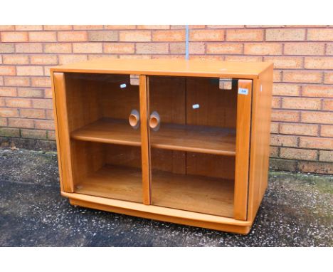 Ercol - A Windsor twin door display cabinet or glazed bookcase, approximately 68 cm x 92 cm x 44 cm. [W]