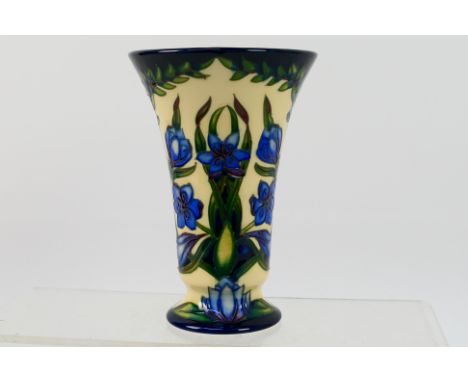 Moorcroft - A Moorcroft Pottery vase of tapering form decorated in the Kaffir Lily pattern, signed in gold ink and dated 14.2