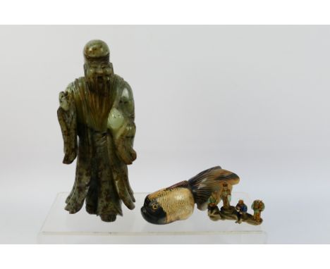 A carved jade / hardstone figure depicting Shou Lao, approximately 21 cm (h), a carved horn study of a fish and small pottery