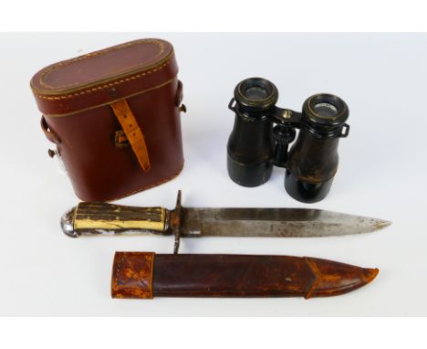 Lot to include a bowie type knife with antler scale grip and 21 cm (l) blade and a cased set of field glasses. [2]. [W]Note: 