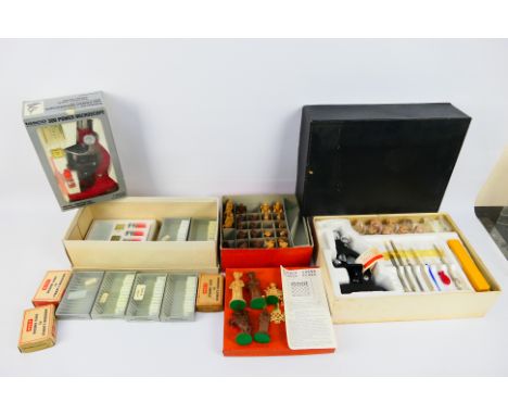 Two boxed vintage microscopes, a quantity of slides and a boxed chess set. [W]