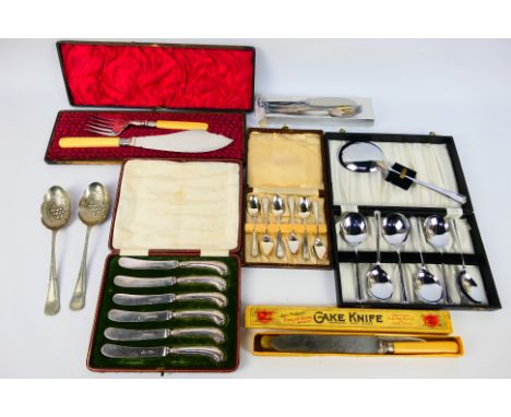 A quantity of flatware, predominantly cased / boxed including a set of six silver handled butter knives. [W]