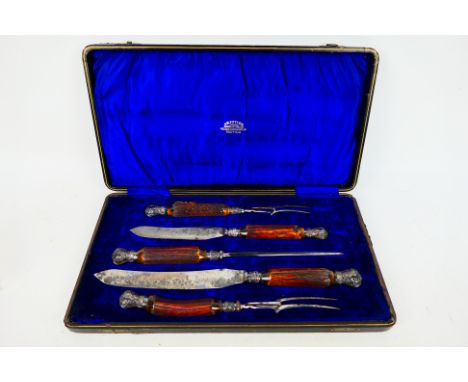 A George V silver mounted, horn handled, five piece carving set, Sheffield assay 1913, sponsors mark for John Biggin, contain