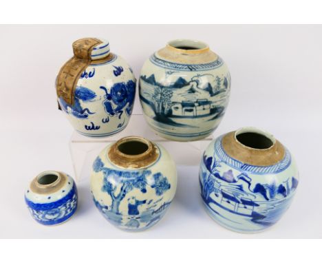 A collection of Chinese blue and white jars (one with cover), two examples similarly decorated with landscape scenes, one wit