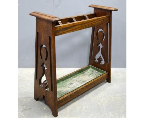 Arts & Crafts oak stick & whip stand. pierced ends with horse shoe motif, 73cm by 68cm