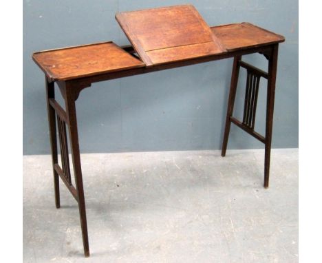 Oak artists table in Arts and Crafts manner.  with easel form top, the sides with arced top and slatted double stretchers. 