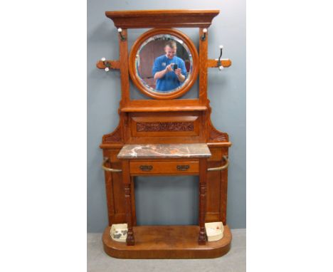 Late 19th / early 20th century carved oak hall stand.  Top with mirror above marble topped drawer on plinth base, 186cm x 109