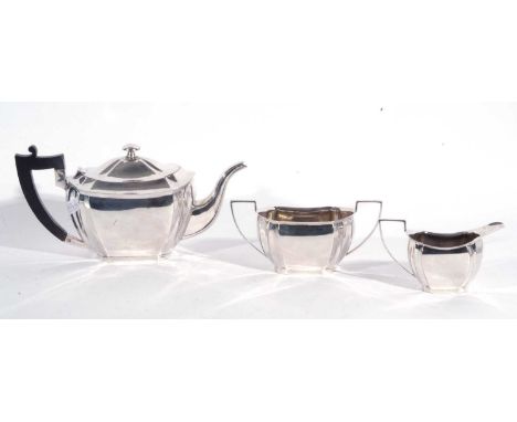 Three piece white metal tea set comprising teapot, sucrier and milk jug of plain form with cantered corners stamped beneath "