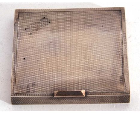 George VI silver ladies compact of square form, engine turned decoration, the sprung hinge clasp opening to a folding hinged 