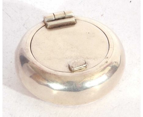 Vintage white metal portable ashtray of squat circular form, hinged lid opening to a cigarette rest and ashtray, 5 cm in diam