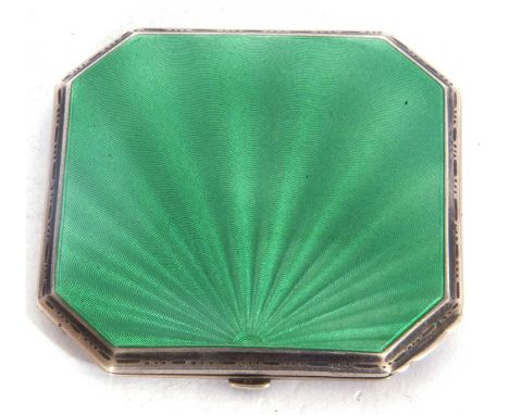 A Art Deco ladies silver and enamel compact of square canted form, the lid with a green guilloche enamel design, the verso wi