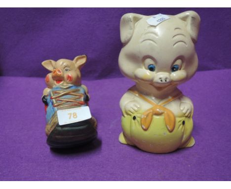Two ceramic money boxes or piggy banks5" and 7" tall, slight chips to paint of larger figure