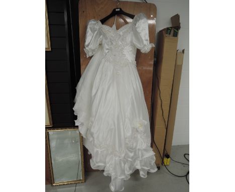 Vintage 1980s wedding dress having Bo peep styling and bead and sequin detailing. Smaller size.