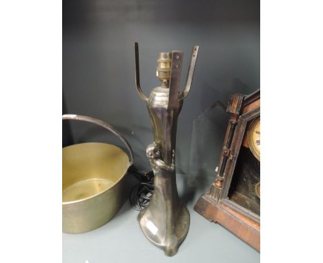 A heavy brass effect lamp base with art nouveau design