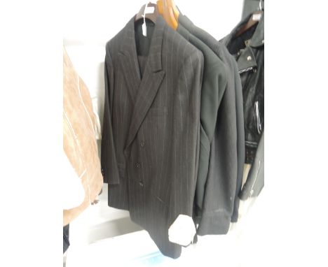 Four mens vintage suits, all approx 1970s, in a variety of sizes and styles including names such as Dunn and co.