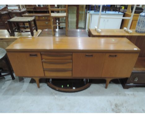 A vintage Teak sideboard, labelled Greaves and Thomas