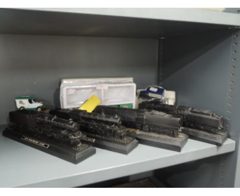A selection of model steam trains and die cast cars 