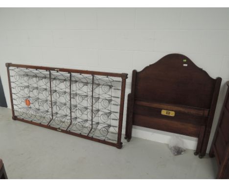 A vintage oak frame bed and sprung frame, labelled Staples and Co