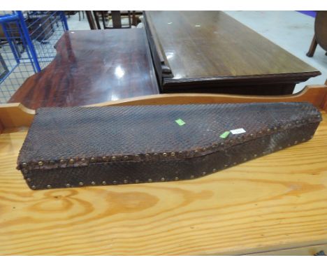 A vintage mutton leg style , faux snakeskin case