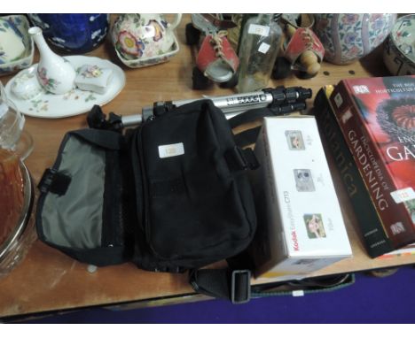 A Kodak easy share C713 camera with bag and tripod