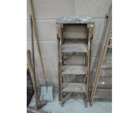 A set of traditional wooden step ladders