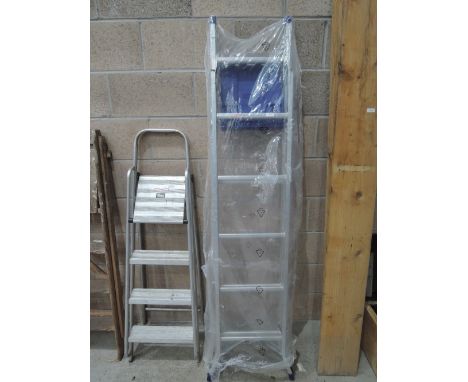 A set of aluminium step ladders ( as new still wrapped)
