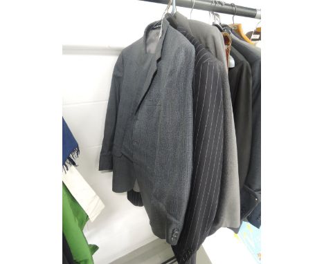 Four mens vintage suits, around late 50s to 80s, in a variety of sizes and styles including names such as Dunn and co.