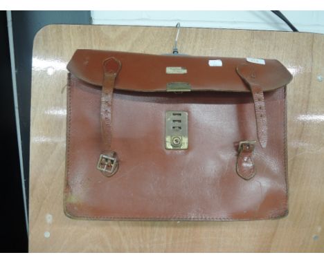 A vintage tan leather breifcase/satchel.