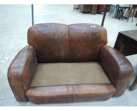 A vintage art deco leather club style settee. Size 4'8" wide, 2'7" high and 3' deepCONDITION REPORT - Has base but no castors