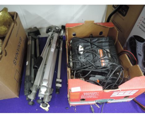 A JVC video camera and two tripods