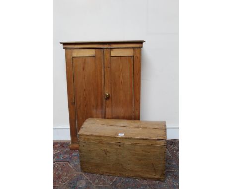 19th century pine dome-top trunk with flanking carrying handles, 68cm wide, together with a pine cupboard (2)