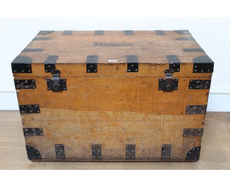 Late 19th century pine and metal bound trunk with end carrying handles, manufacturer's label to lid for MacGregor, Portmantea