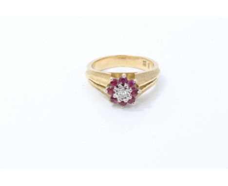 Gold (18ct) diamond and ruby flower-head cluster ring.  Ring size P   CONDITION REPORT  Total gross weight approximately 7.1 