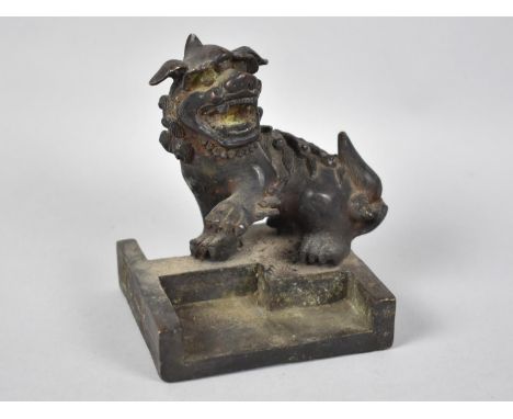 A Heavy Chinese Bronze Seal in the Form of a Temple Dog with One Paw Raised, Square Base, 9.5cms 