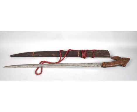 An Indonesian Kris Type Sword with Carved Wooden Hand and Scabbard, Blade with Flat Side and Curved Side, 78cms Long Overall 