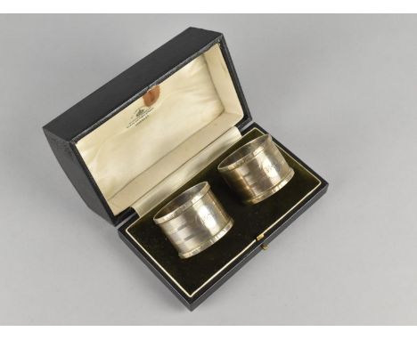 A Cased Pair of Engine Turned Napkin Rings by Mappin &amp; Webb Ltd, Monogrammed E.S, Birmingham Hallmark 