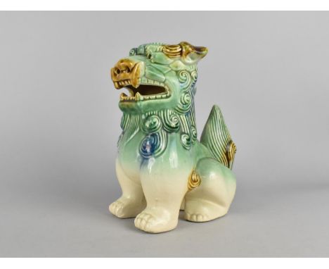A Chinese Glazed Ceramic Study of a Seated Temple Dog, 22cms High 