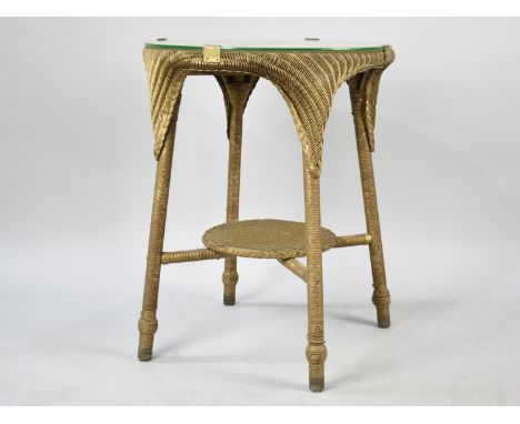 A Lloyd Loom Table with Stretcher Shelf, 56cms Diameter 