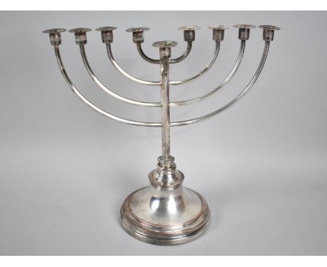 A Sheffield Plated Jewish Menorah Candlestick, 23cms Wide and 22cms High 