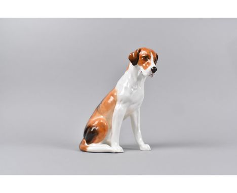 A Royal Worcester Figure of a Seated Foxhound, 18cms High 